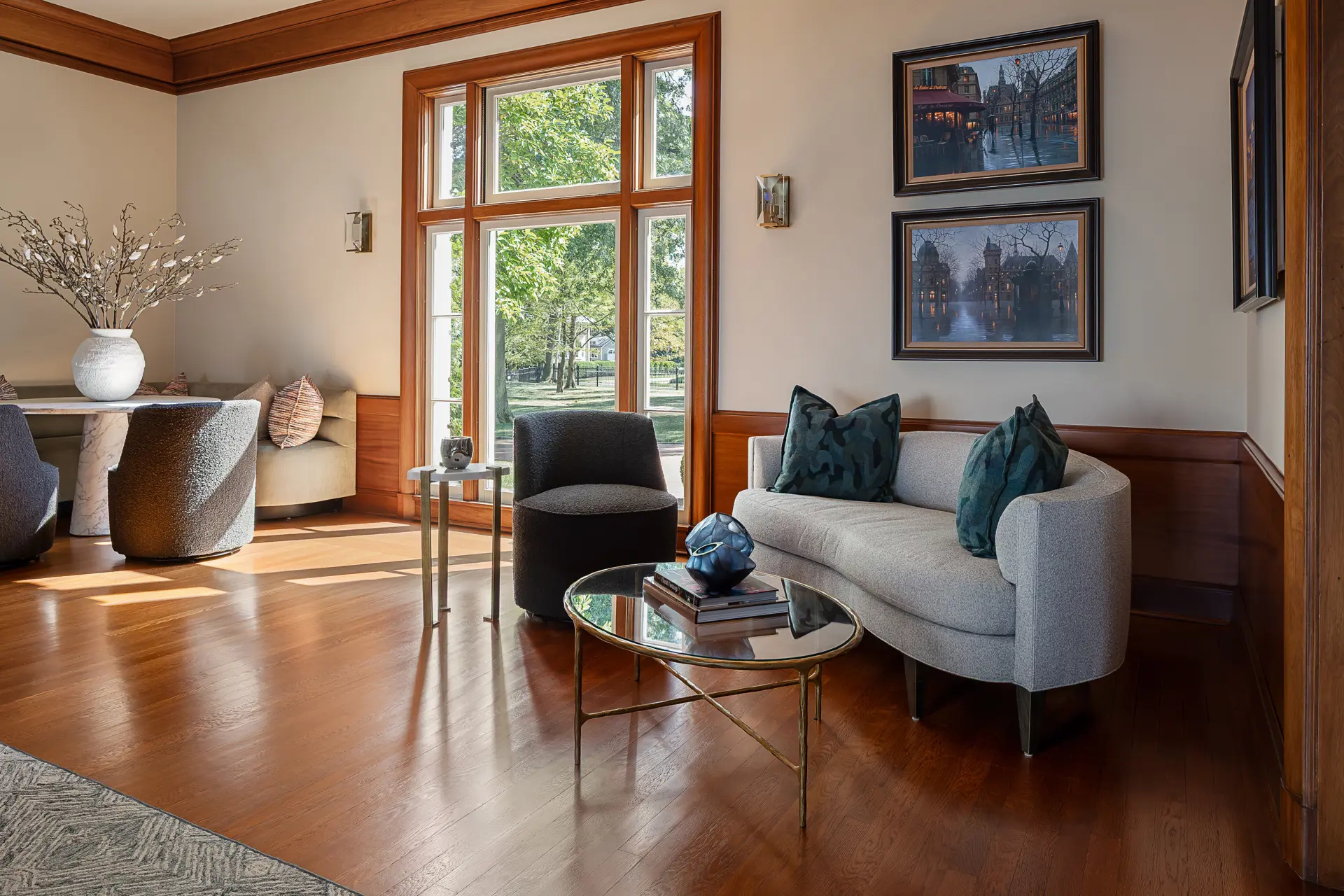 sitting area with grey couch and chairs
