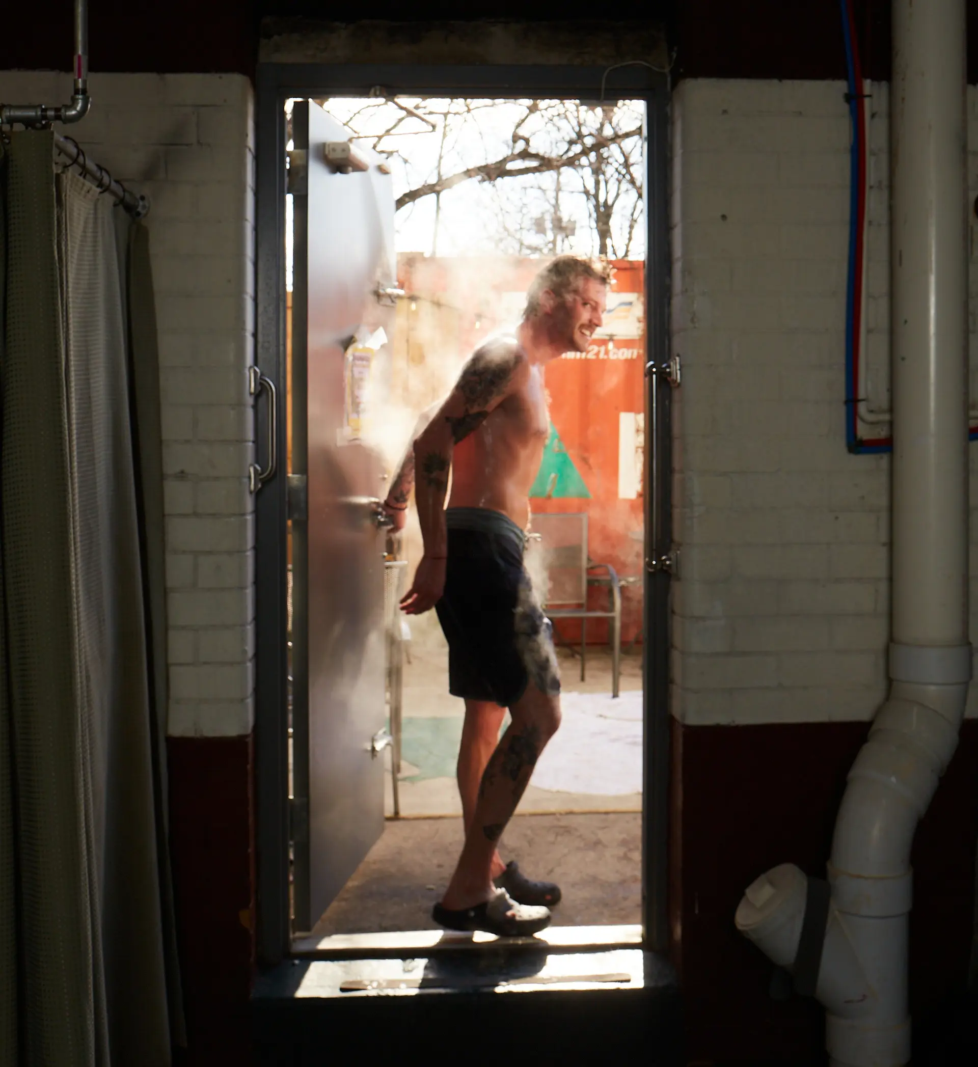 Person stepping outside of a steam room